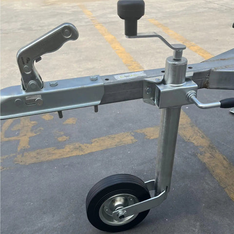 Heavy Duty Swivel Trailer Jack Wheel With Foldable 48mm Stand And Rustproof Galvanized Finish For Off Road Trailers And Beach Rigs No Sweat Pipe Clamp Setup on trailer frame.