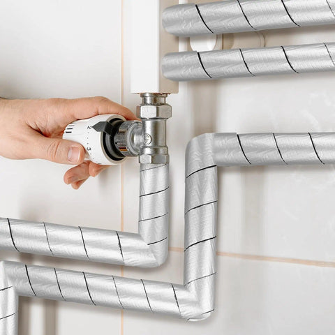 Self Adhesive Pipe Insulation Foam Tube Kit with 32.8 ft of 2 inch wide foam applied to outdoor pipes for freeze protection
