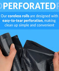 Hands holding perforated coreless rolls of Heavy Duty Black Trash Bags 500 Count 16 To 25 Gallon Garbage Sacks for easy disposal.