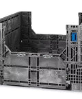 Hella Tough Collapsible Bulk Storage Bin And Heavy Duty Shipping Crate With 1500 Pound Load Capacity For Machinery Parts And Bulky Loads 48X45X34 Inches Reusable Industrial Packing Box displayed from a side angle.