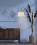 52 Inch Floor Lamp With Faux Wood Finish And White Pattern Shade Japandi Style next to modern decor in living room scene