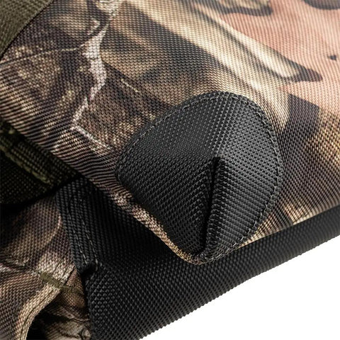 Close-up of Three Bag Tool Bag Set With Suspenders in Mossy Oak Camo, showing heavy duty 1680D poly fabric and reinforced bottom.