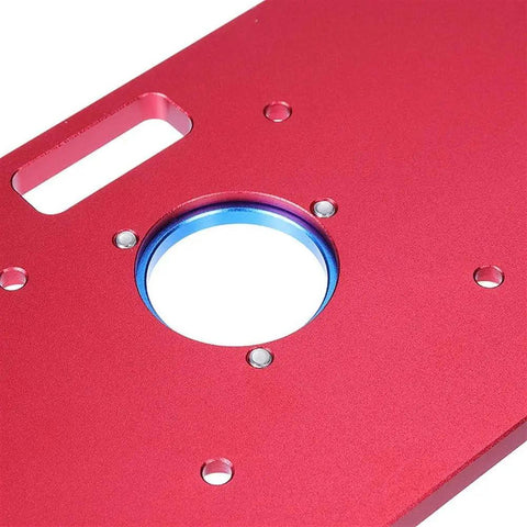 Premium Universal Aluminum Router Table Insert Plate With Heavy Gauge Ring For Kick Butt Performance And No Fuss Setup Works Flawlessly With Standard Drill Chucks 235X120X8Mm, close-up of red surface with blue ring.