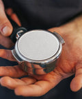 Hella Smooth Reusable Stainless Steel Coffee Filter Fine Mesh shows fine mesh screen in hand, compatible with 51Mm brewers for bold flavors.