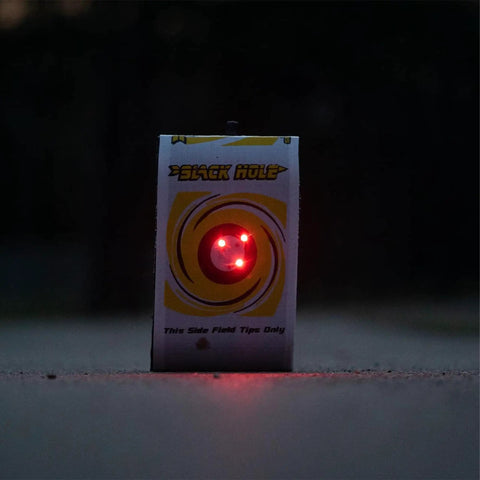 4 Sided Archery Target For Field Points And Broadheads, visible in dim light with a glowing target bullseye, 18x16x11 inches