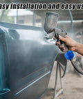 Spray gun with Six Pack Disposable Mini Air And Water Filter Cartridges for a slicker paint finish on blue car panel