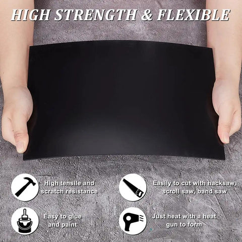Person holding two black ABS plastic sheets 11.8 by 7.9 inches 2mm thick hard modeling plastic for architectural models sand table projects DIY.