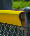 Close-up of Premium Fence Topper 50 Ft Yellow Chain Link Fence Cover High Viz UV Resistant Injury Prevention Safety Fence.