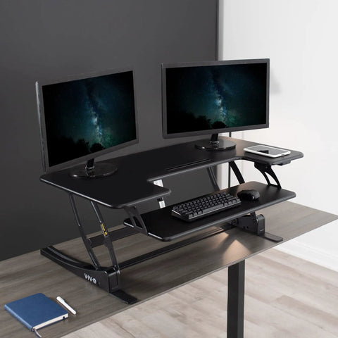 Electric Height Adjustable Desk Converter with Sit to Stand Function and Dual Monitor Riser 42 Inch, black finish in home office