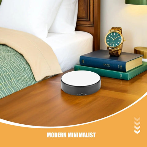 Heavy Duty Motorized Electric Rotating Platform With Remote Control For Jewelry Display on a bedside table with books.
