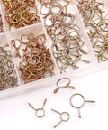 310 Piece Hose Clamp Set With 9 Sizes From 5 To 13 mm Galvanized 65Mn Spring Clips organized in a plastic box