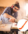 Carpenter using heavy duty woodworking push block handle for table saw and jointer safety, orange carpenter grip visible in close-up.