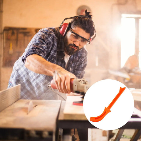 Carpenter using heavy duty woodworking push block handle for table saw and jointer safety, orange carpenter grip visible in close-up.