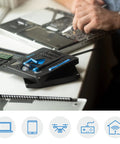 All In One Electronics Repair Kit With 16 Precision Bits And Magnetic Screwdriver on desk next to open laptop