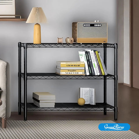 Adjustable Three Tier Metal Wire Shelving Unit In Sleek Black With Flexible Height Configuration Easy Peasy Assembly Perfect For Garage Pantry Or Closet Nifty Space Saver Built Tough To Handle All Your Daily Essentials Quick Setup with books, lamp, and decor.