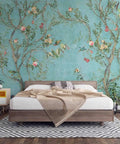 Chinoiserie Floral Wallpaper With Birds In Turquoise Backdrop behind bed, removable peel and stick, ideal for living rooms, 100x150.