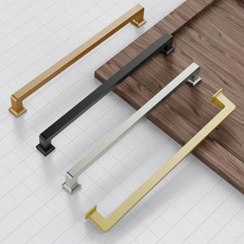 Sleek Gold Cabinet Pulls And Zinc Alloy Handles Set Of 6 For Kitchen Drawers features gold, silver, and black cabinet pulls placed on a wooden surface.