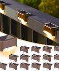 Top Shelf Solar Deck Lights 16 Pack, Slick Brown Shell Step Lights With Bright Warm White Glow, Weatherproof Outdoor Pathway Runners on railing.
