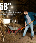 Man using Heavy Duty Garden Pitch Fork With 5 Tines And Fiberglass Handle 58 Inches One Piece High Carbon Steel Head Rust Resistant Coating Non Slip Grip A Real Workhorse For Compost Leaf Litter And Tilling Soil in barn filled with hay.