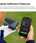 Person holding Smart Laser Rangefinder For Golf With Slope And Wind AI Powered Plays Like Distances Green Maps And On Course Pro Grade Game Plan Tournament Legal Toggle Free First Year Membership Weather Aware Yardage For Realistic Shots next to smartphone displaying update alert