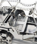 3D Metal Car Puzzle Model Kit With Mechanical Iron Blood Design, Dope DIY Buildable Vehicle For Adults Teens Men And Women, Stainless Steel Craft Kit For Collectors And Hobbyists Who Love Hands On Projects. close-up of stainless steel car puzzle wheel and frame