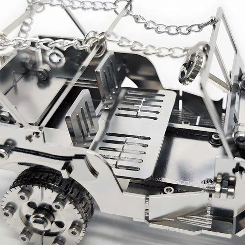 3D Metal Car Puzzle Model Kit With Mechanical Iron Blood Design, Dope DIY Buildable Vehicle For Adults Teens Men And Women, Stainless Steel Craft Kit For Collectors And Hobbyists Who Love Hands On Projects. close-up of stainless steel car puzzle wheel and frame