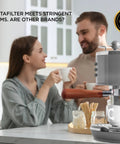 Couple enjoying coffee with Bottomless 54mm Portafilter For Espresso Machines With Puck Filter Included, Breville Compatible Barista Express.