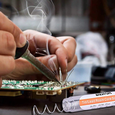Person soldering electronics with Six Pack 60-40 Rosin Core Solder Wire Tin Lead For Electronics Soldering Tools 0.8mm Diameter 20g
