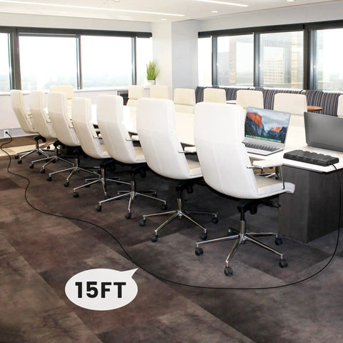Conference room setup with laptops, powered by a 15 ft ultra flat plug extension from 28 In 1 Power Strip Surge Protector.