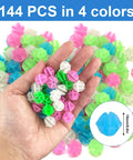 Hand holding colorful glow in the dark bike spoke beads set for kids, 144 colorful plastic round beads that clip on and make fun noise