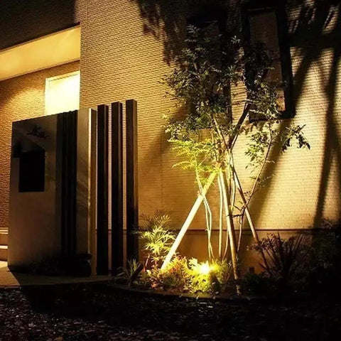 Night scene with Rugged Waterproof PAR36 LED Landscape Bulb Kit 9W 900LM 3000K illuminating a garden area