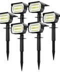 Six Pack Solar Landscape Spotlights With 48 LEDs And Three Brightness Modes For Custom Ambience Outdoor 2 In 1 Solar Spot Lights Auto On Off IP67 Waterproof Wall Lights For Front Porch Backyard Garage Deck Patio, shown with ground stakes for installation.
