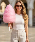 Woman holding large pink cotton candy on Cotton Candy Sticks And Paper Cones Pack 50 Pcs 11.8 Inch Candy Holder Sticks