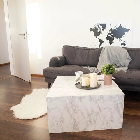 Living room with a coffee table covered in Grey Marble Peel And Stick Self-Adhesive Film Roll 17 Inch By 78 Inch For Walls Cabinets Furniture.
