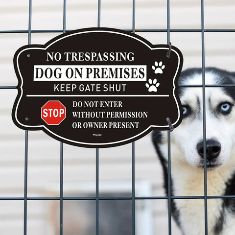 2 Pack No Trespassing And Dog On Premises Yard Signs, 10 By 7 Inch Rock Solid Aluminum Warning Plates displayed on a fence with a dog behind.