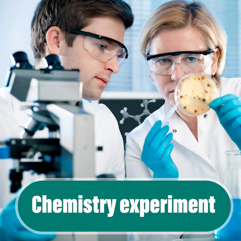 Scientists conducting a chemistry experiment with petri dish under microscope in lab