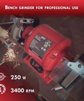 6-Inch Bench Grinder With Dual Eye Shields, 3400 RPM, 2.1A, 1/3 HP, shown grinding metal, with sparks visible.
