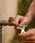 Thinking Process: brass 6mm faucet key tool turning an outdoor water valve