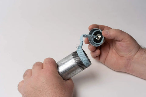 Applying Megaloc Multi-Purpose Thread Sealant Can Blue Liquid Paste 8 Oz 236 Ml One Half Pint Kevlar Reinforced No Odor Non Flammable on metal pipe