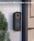 No Drill Stick-On Door Mount For 1st Gen Video Doorbell installed on a wall, adhesive mount bracket with protective cover in black.