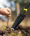 Heavy Duty Stainless Steel Garden Shovel With Serrated Edge For Digging And Transplanting V Shaped Tip in use, yellow handle