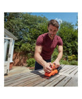 Heavy Workhorse Orbital Sander With One Third Sheet Pad And Quick Attach Clamps Cranks Out 14000 Rpm in use on wood.