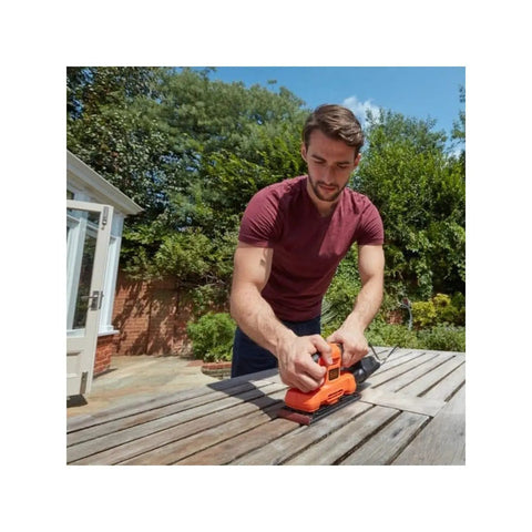 Heavy Workhorse Orbital Sander With One Third Sheet Pad And Quick Attach Clamps Cranks Out 14000 Rpm in use on wood.