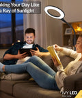 Couple reading under Gooseneck LED Floor Lamp For Office Reading And Bedrooms Non Glare Eye Safe Lighting 600 Lumens From 3 Watt LED Energy Saver Lit Brightness Ideal For Lash Extensions Makeup And Nail Spa Black