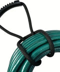 Heavy Duty Nylon Cord Strap Organizer Rope for Tailgate Parties and Campouts holds generator cords tight around coiled green hose.
