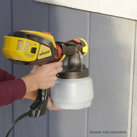 Person using iSpray Front End Nozzle For HVLP Sprayers Broad Interior And Exterior Coverage With Unthinned Coatings on blue wall