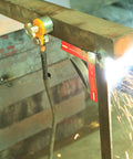 Magnetic Welding Ground Clamp With On Off Switch 40 Kg Pull 300 Amp Rated Ground Block in use during welding on metal beam