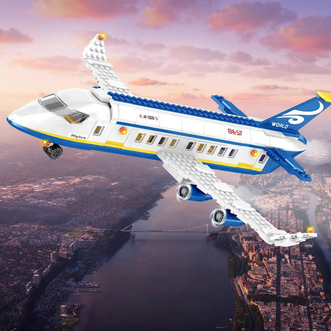 6 In 1 Airport Passenger Plane Building Set With 510 Pieces For STEM Play flying over a cityscape at sunset.