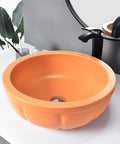 Round Sink Bowls For Bathroom Vessel Sink, 15.7 Inch Ceramic Vessel Sink in orange on counter with faucet and drainer.