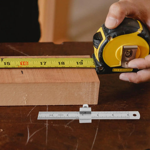 Stainless Steel Ruler With Clip Stopper, Precision Machinist Straight Edge next to tape measure on wood, clear accurate measurements.